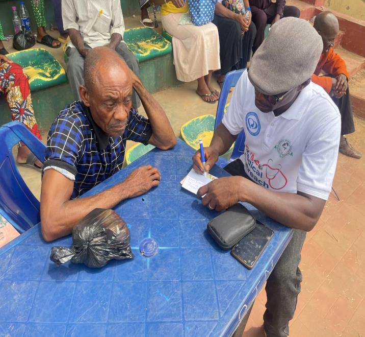 Medical consultation, BP check, and drug dispensing ongoing during the free medical outreach.